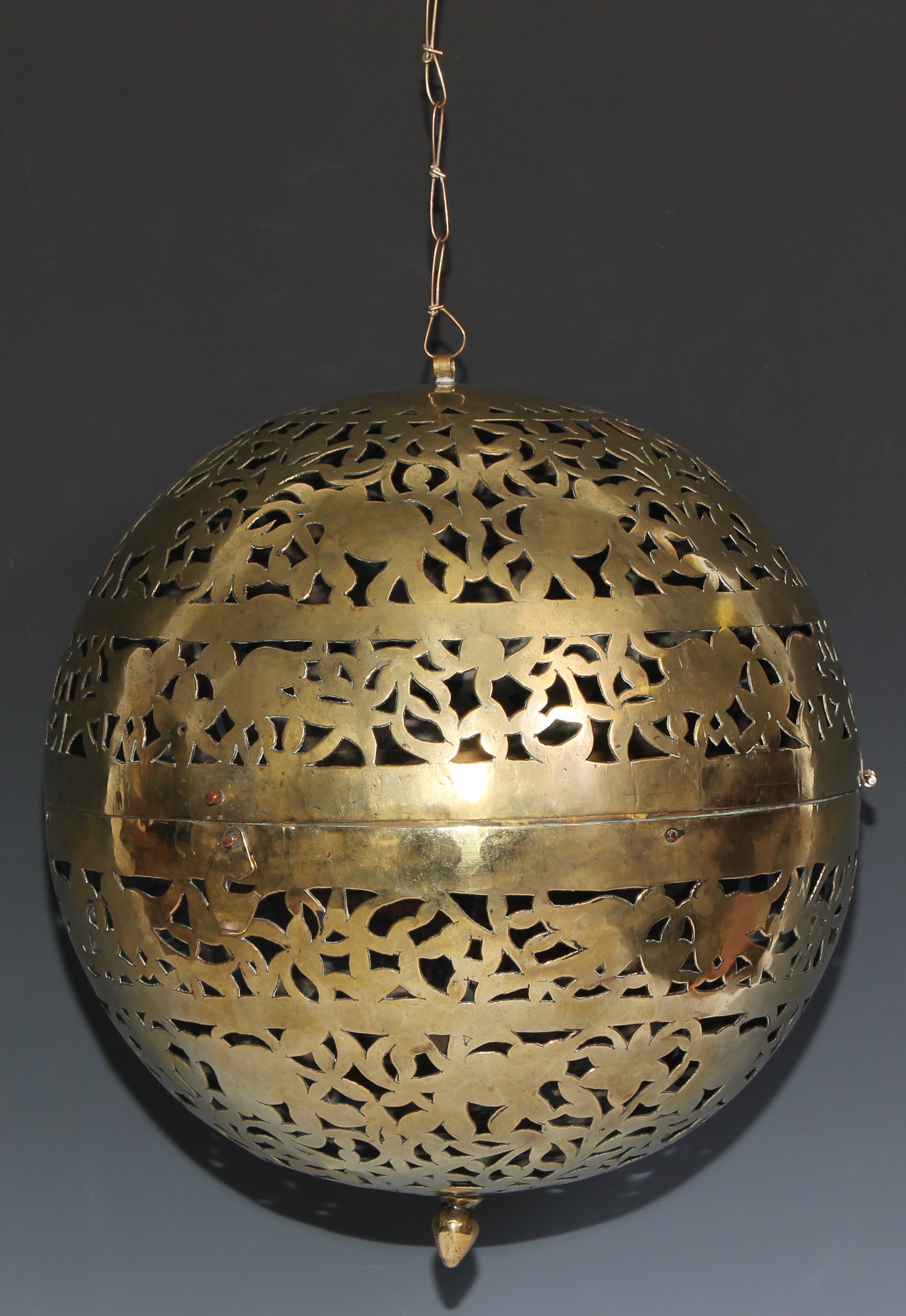 A large Indian/Middle Eastern rolling lamp, or shadow or incense ball, pierced with birds and