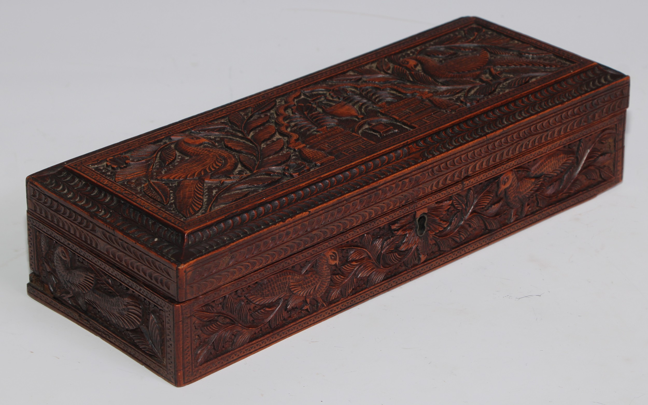 An Indian sandalwood rectangular box, hinged cover, carved in relief with peacocks, architecture, - Image 2 of 3