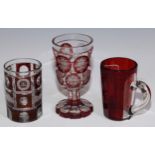 A Bohemian ruby overlaid glass spa beaker, etched with named views of Altenberg and other landmarks,