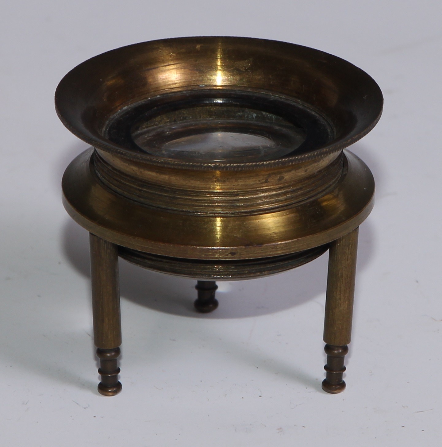 Cartography - an early 20th century lacquered brass tripod map reading lens, 4.5cm diam