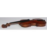 A 19th century violin, the well figured one-piece back 36cm long excluding button, outlined