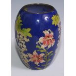 A Japanese cloissone ovoid vase, decorated in polychrome with wisteria and other flowers on a blue