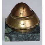 An early 20th century novelty inkwell, of military trench art interest, formed from the head of an