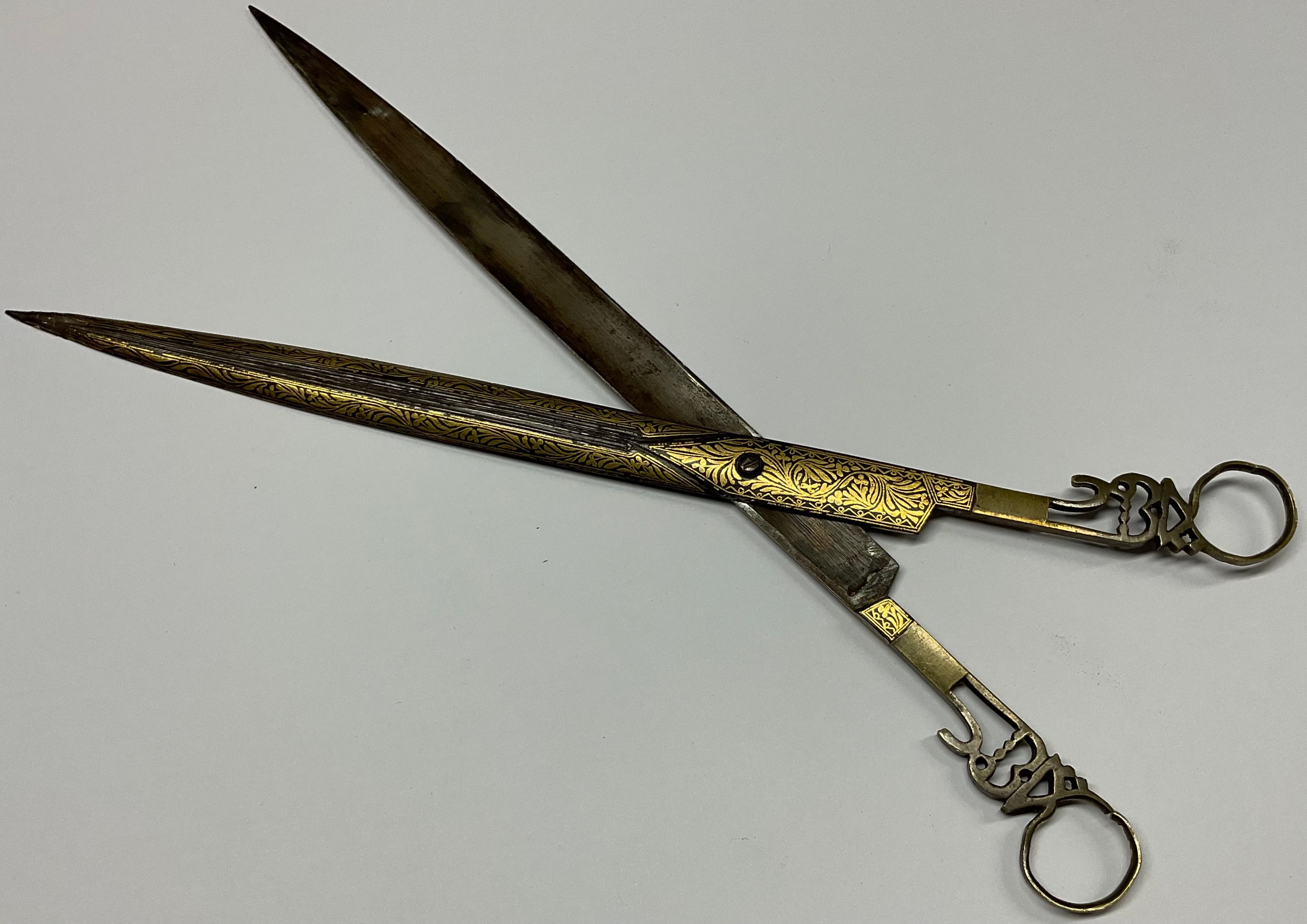 A pair of Middle Eastern Islamic calligraphy scissors, damascened in ...