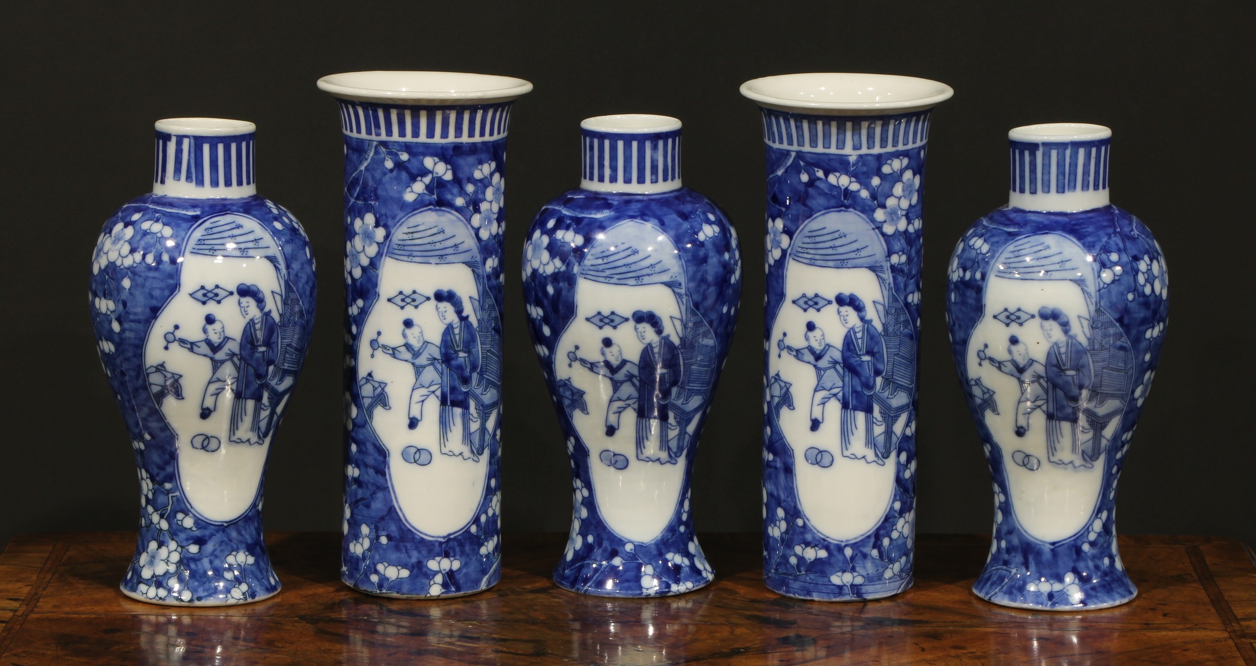 A Chinese five piece garniture, comprising three baluster vases and a pair of sleeve vases, each