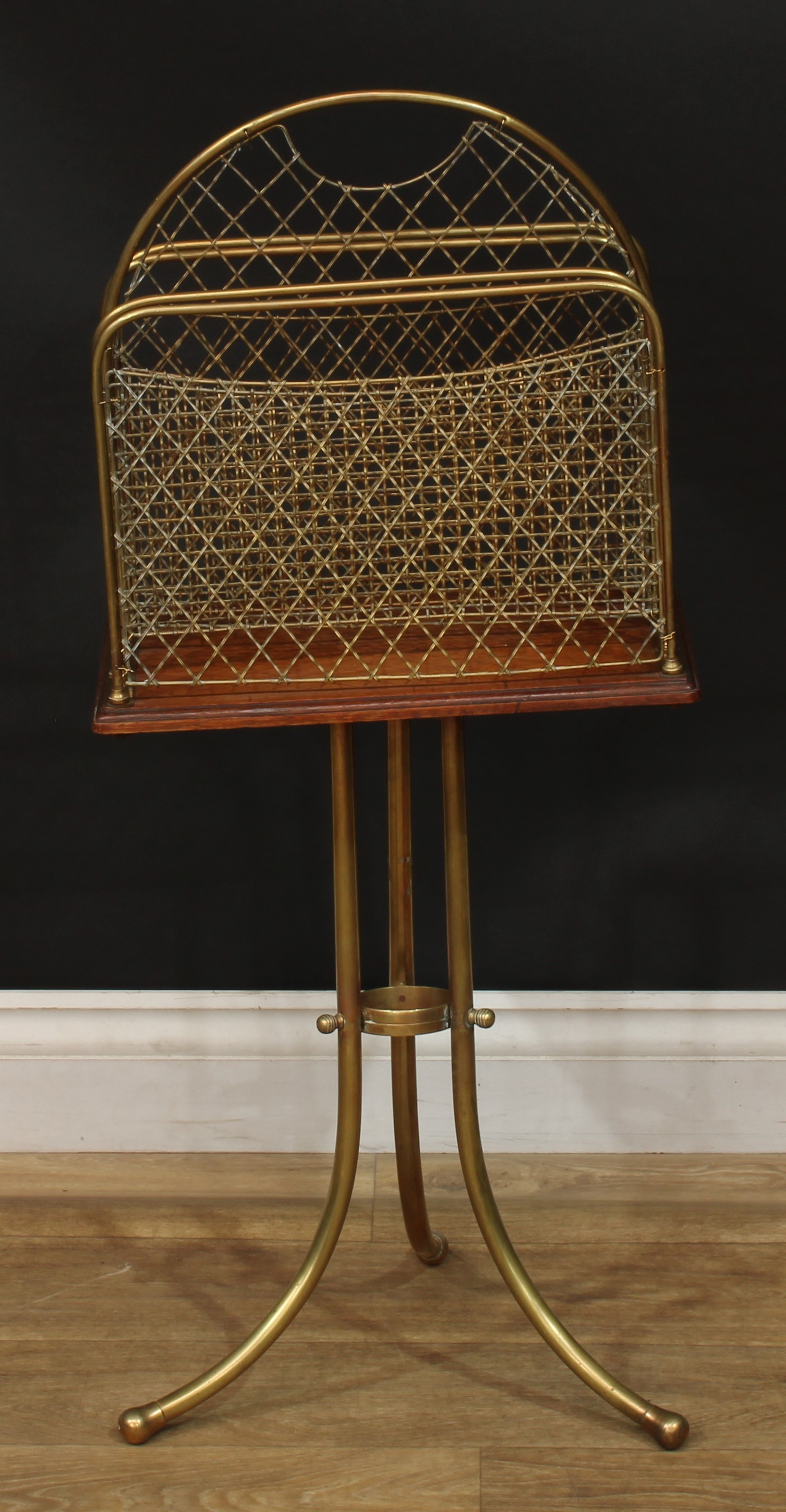 A late Victorian Hall patent brass and oak revolving Canterbury, 86cm high, 37.5cm wide, 23cm