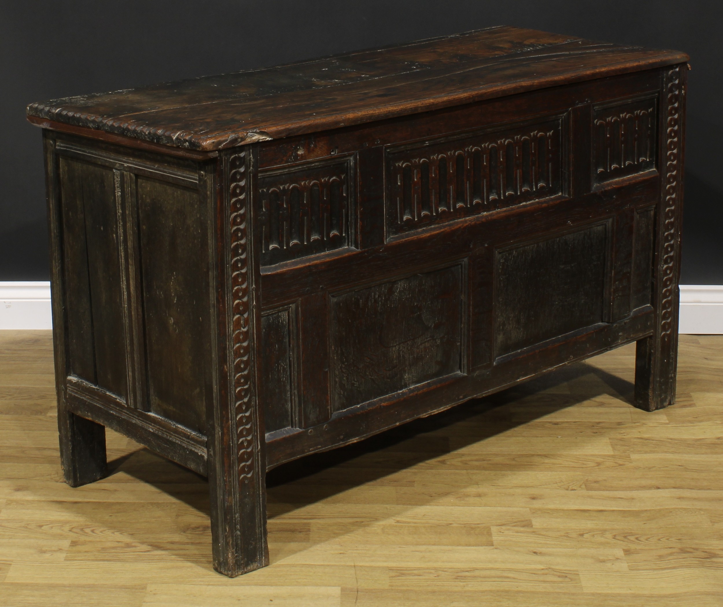 A late 17th century oak blanket chest, hinged top above a nulled panel front, the stiles carved with - Image 2 of 5