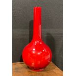 A Bernard Moore flambé globular base, elongated cylindrical neck, signed to base, 29cm high