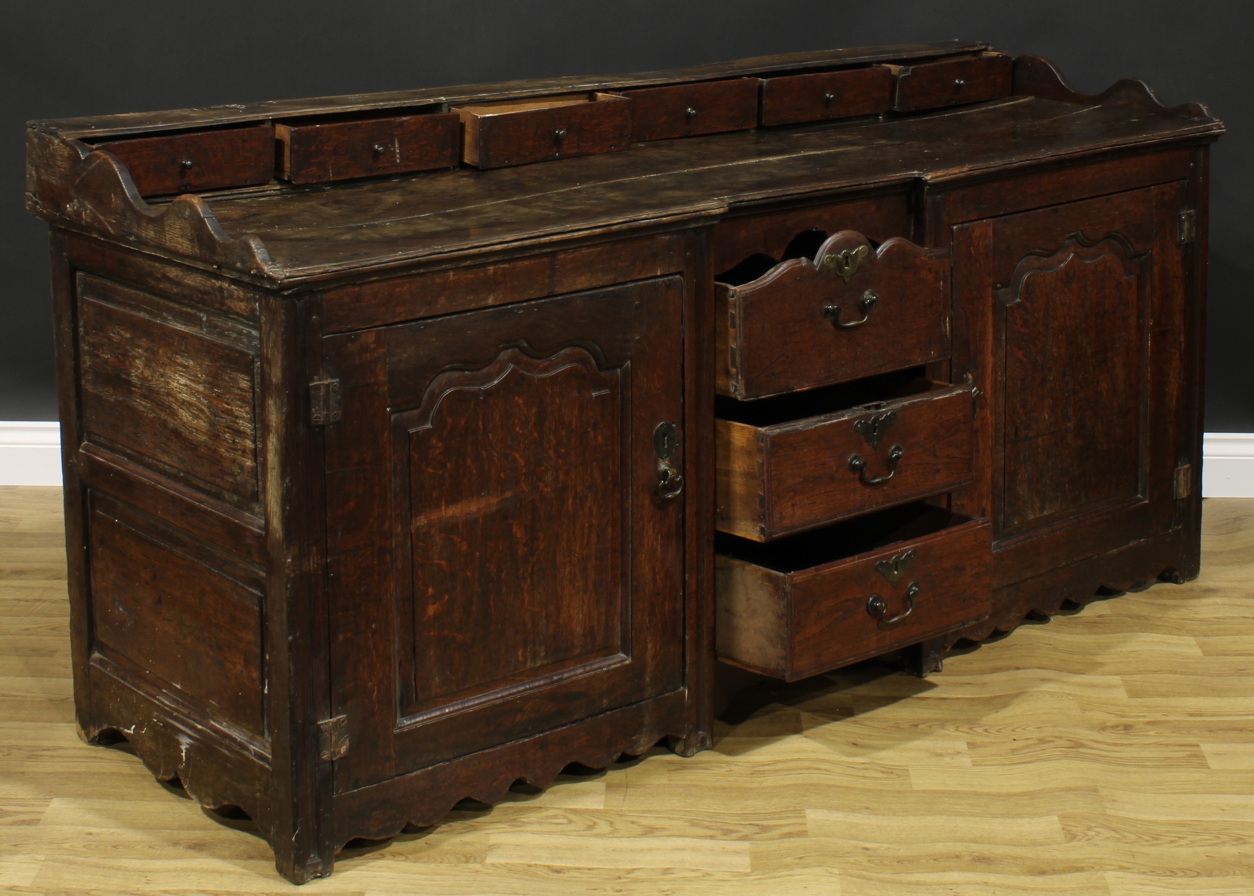 An 18th century oak low dresser, rectangular top with six small drawers above a pair of raised and - Image 5 of 6