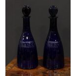 A pair of 19th century Bristol blue slender mallet shaped decanters, etched Brandy and Rum within