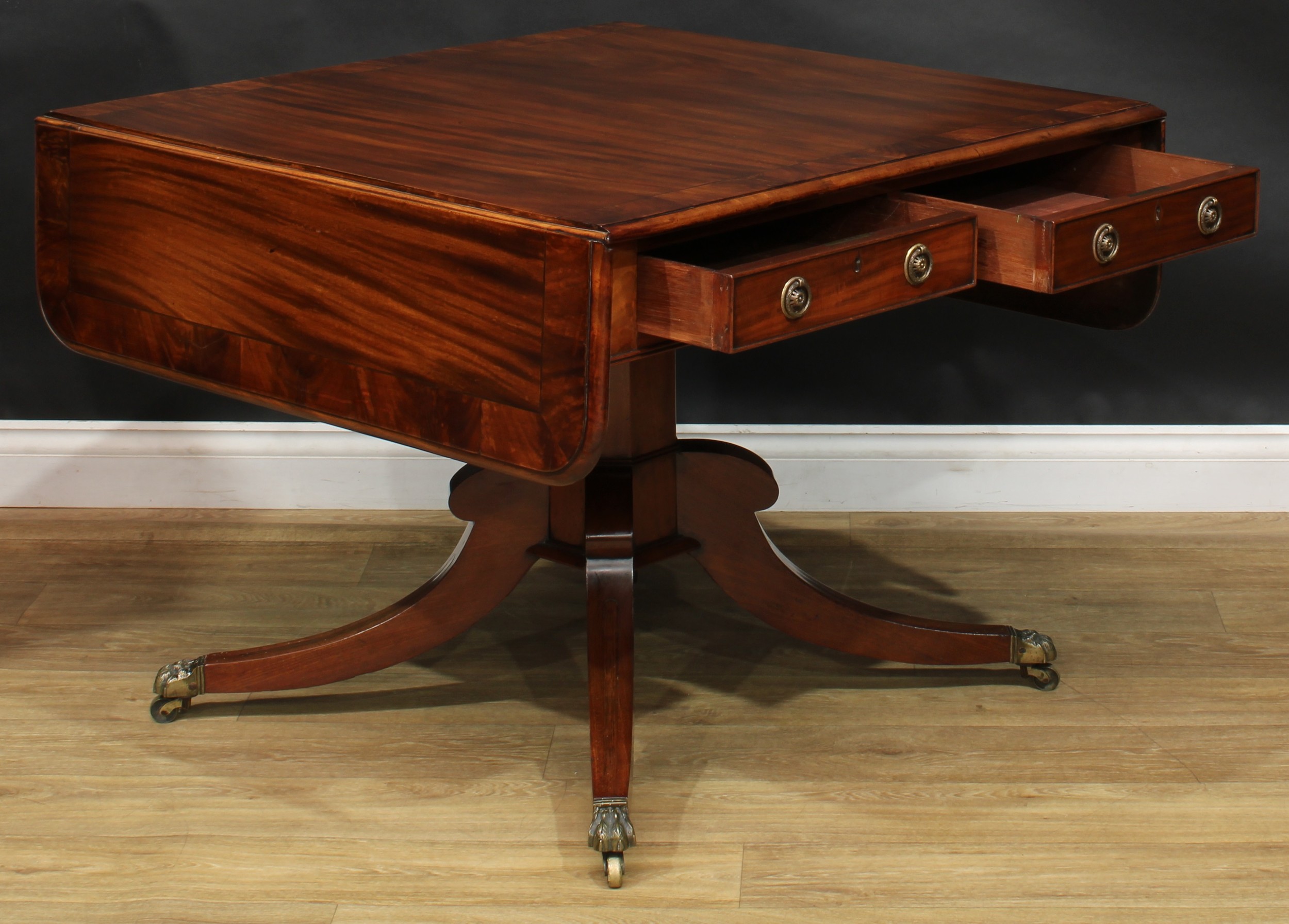 A Regency flame crossbanded mahogany sofa table, rounded rectangular top with fall leaves above a - Image 5 of 7