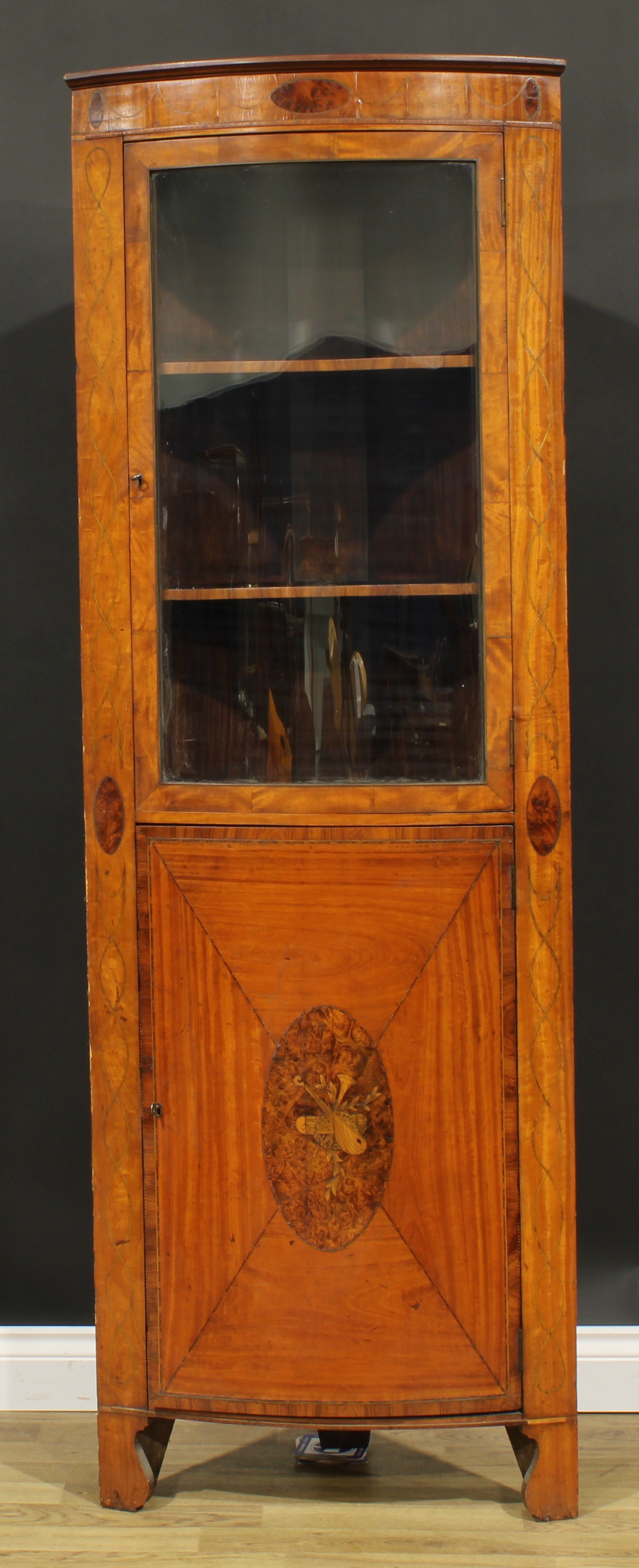 A Sheraton Revival satinwood and marquetry floor-standing bowfront corner display cabinet, moulded - Image 2 of 2