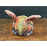 A Bernard Moore lustre model, of a stylised long eared rabbit, glazed in mottled tones of mauve,