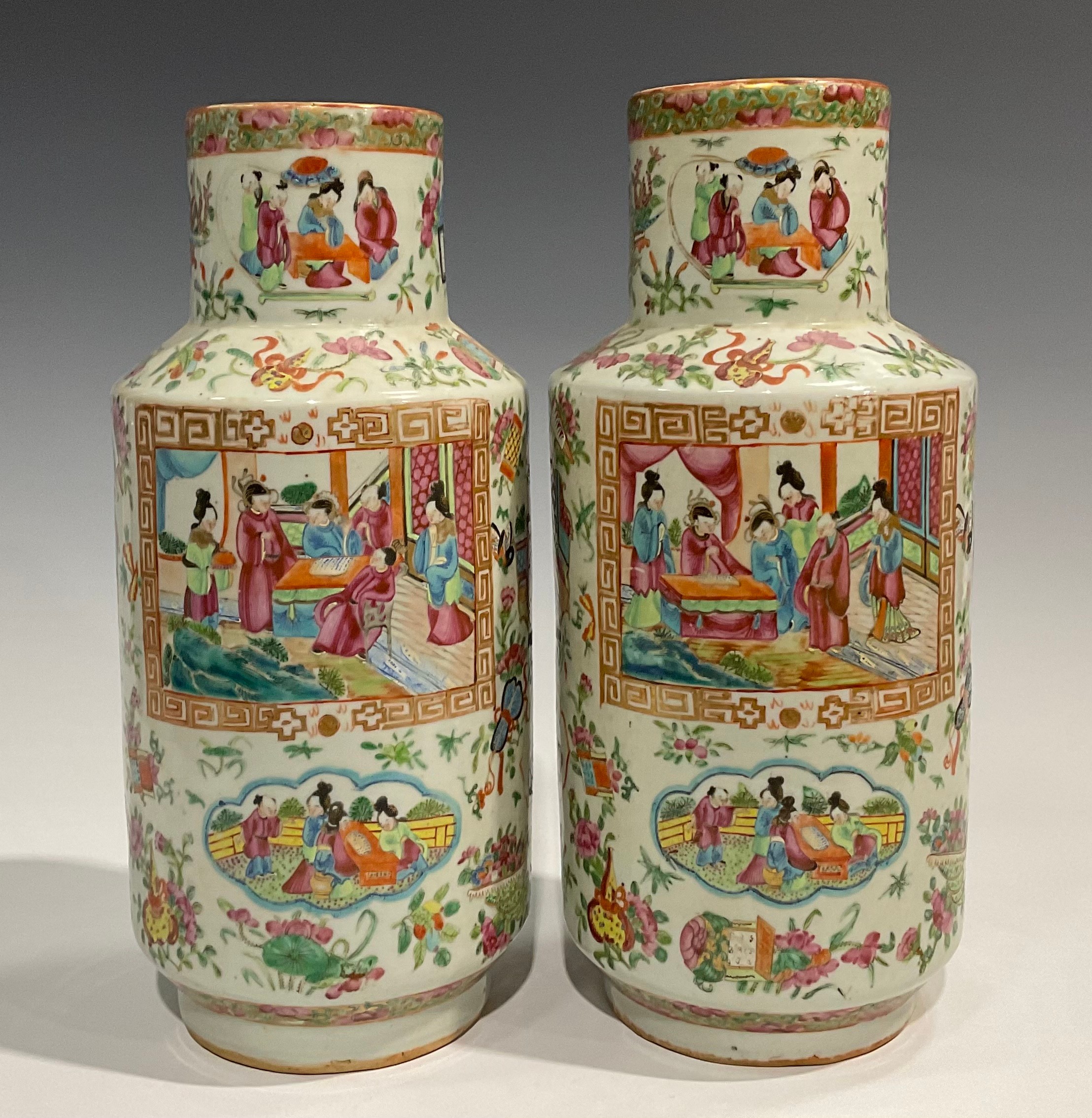 A pair of Cantonese Famille Rose cylindrical vases, decorated with alternating shaped panels of - Image 4 of 5