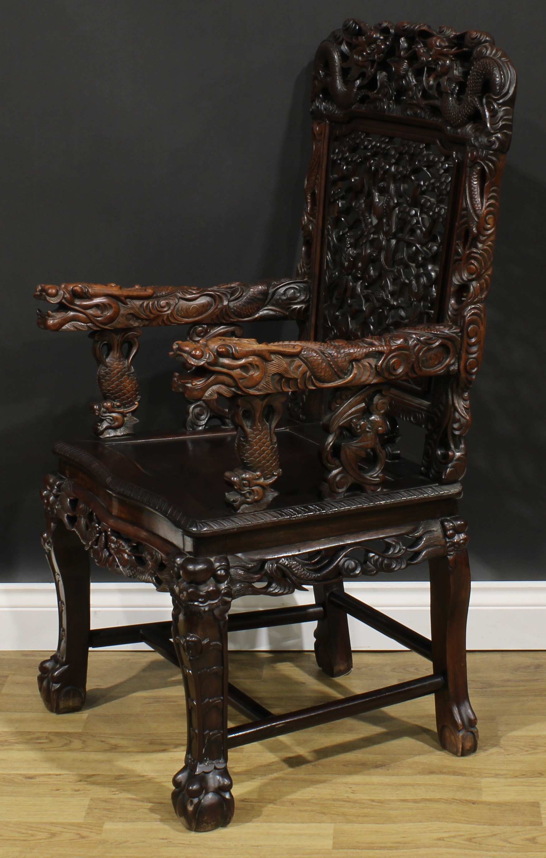 A Chinese hardwood armchair, shaped cresting rail pierced and carved with two dragons and a - Image 3 of 4