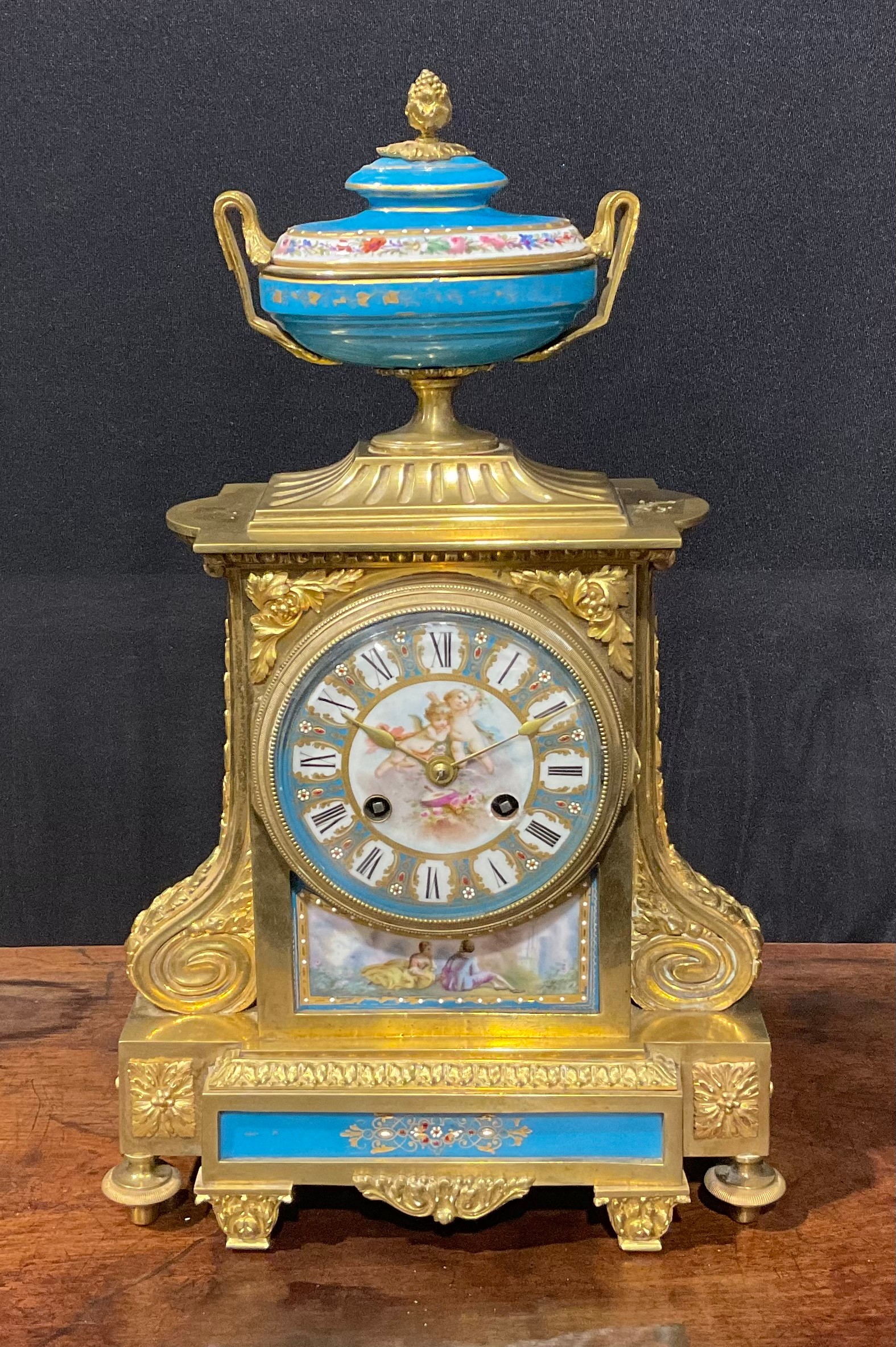 A 19th century French porcelain mounted gilt metal mantel clock, 10.5cm dial inscribed with Roman