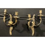 A pair of Rococo Revival gilt metal two-light wall sconces, cast with scrolling acanthus, 32cm high