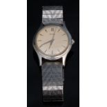 A gentleman's Piaget stainless steel wristwatch, cream dial, baton hour markers, sweeping centre
