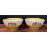 A pair of Clarice Cliff Crocus pattern bowls, hand painted in bright colours, 22.5cm diameter,