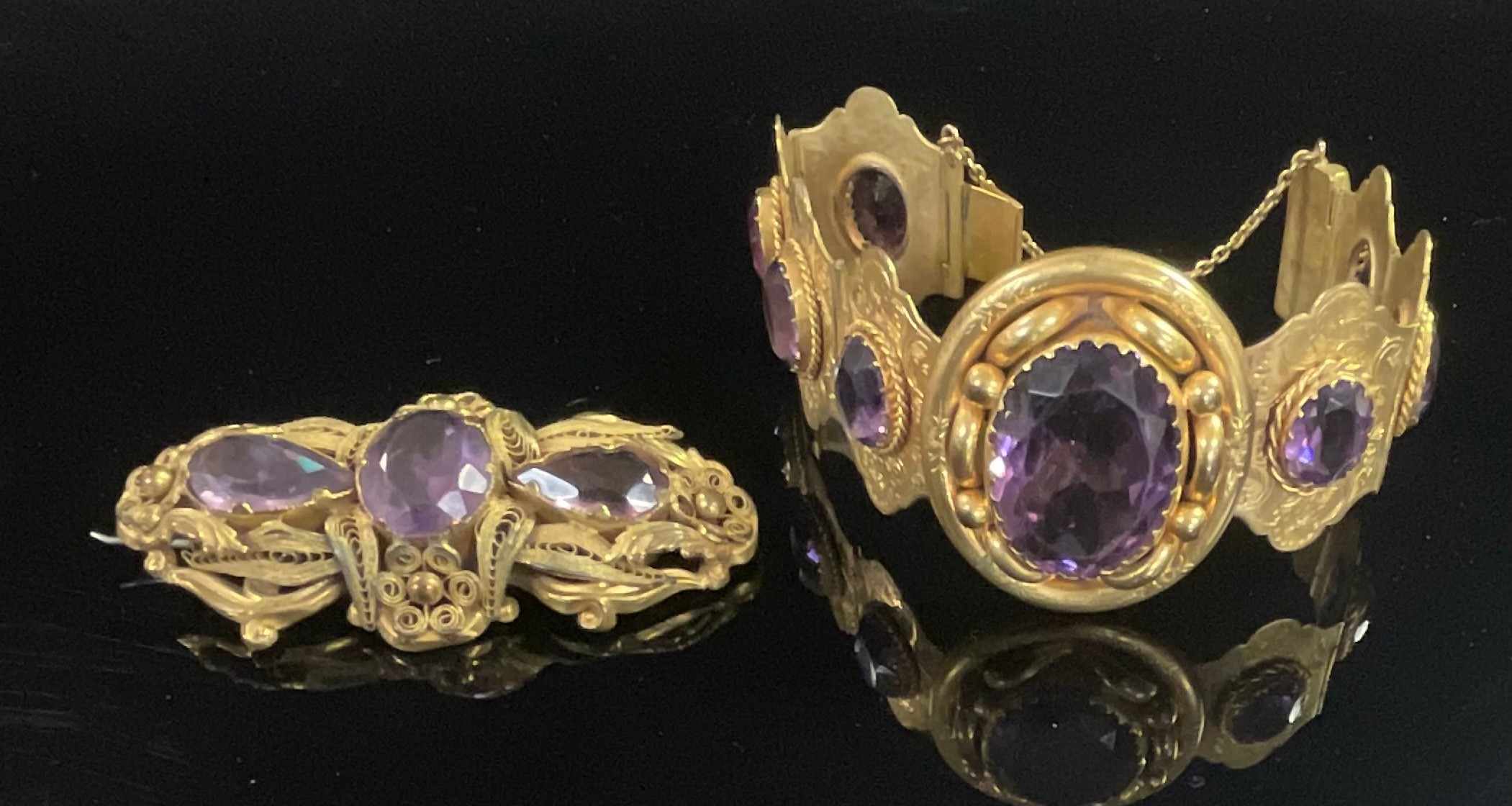 A 19th century pale purple amethyst and gilt metal bracelet, set with one large and seven smaller