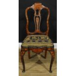 A 19th century Dutch marquetry side chair, shaped back inlaid with a mask, leaves and trailing
