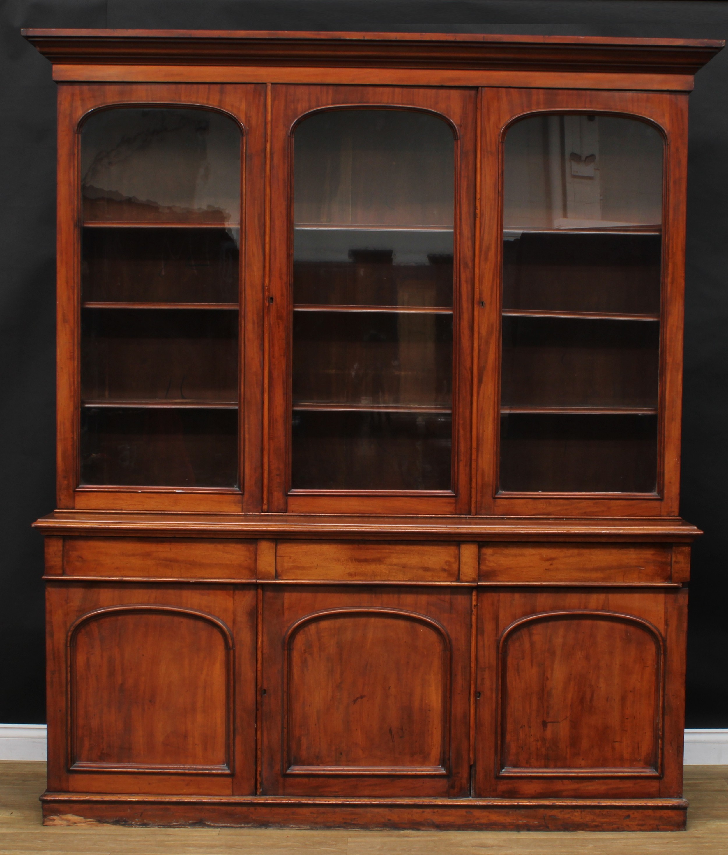 A Victorian mahogany library bookcase, moulded cornice above three glazed doors enclosing adjustable - Image 2 of 2