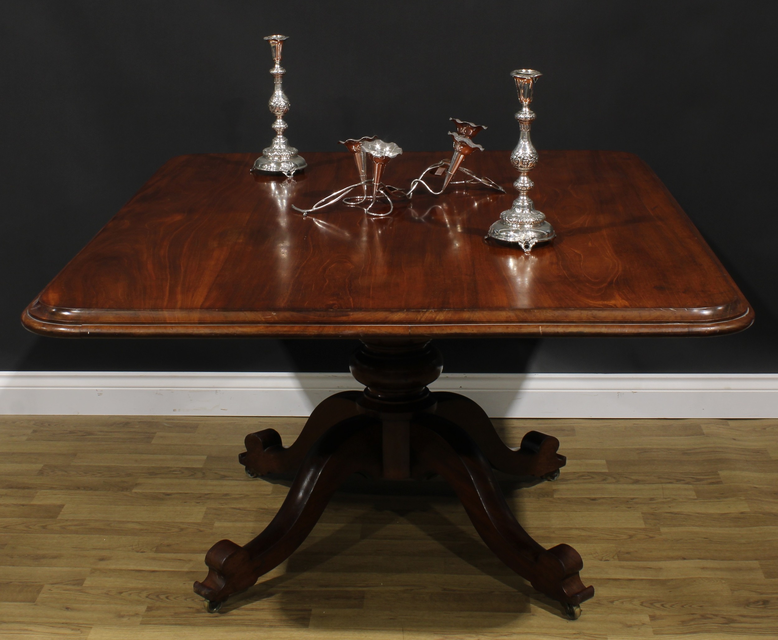 A 19th century mahogany breakfast table, rounded rectangular tilting top, turned column, cabriole