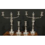 A post-Regency Old Sheffield Plate four-piece table lighting suite, comprising a pair of three-light