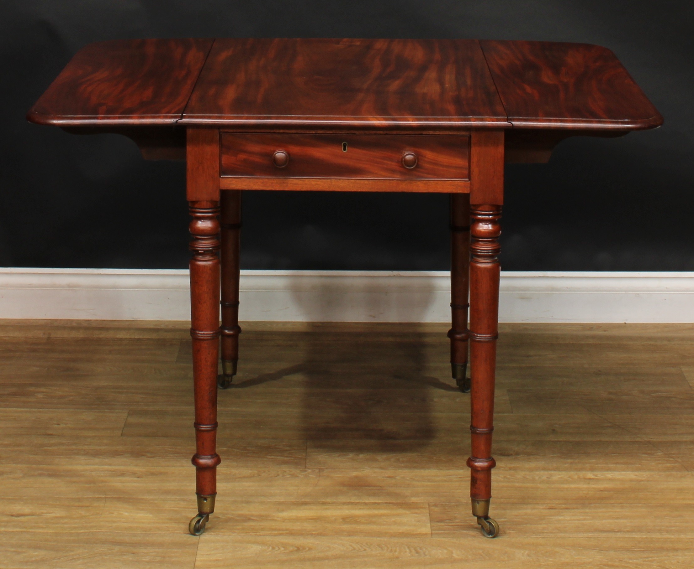 A George IV mahogany Pembroke table, rounded rectangular top with fall leaves above a single - Image 3 of 7