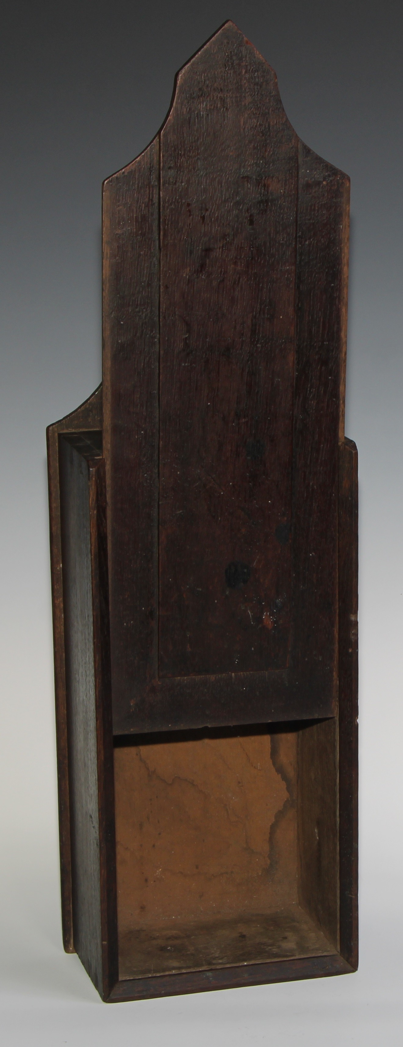 A George III oak candle box, possibly Welsh, pointed arched cresting, raised panelled sliding cover, - Image 3 of 4