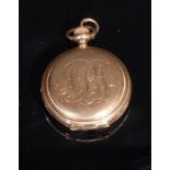 A full hunter Elgin pocket or fob watch, stamped '14K' for 14ct gold, white enamel dial, Roman