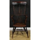 A 19th century fruitwood, elm, ash and beech Windsor elbow chair, tall tapered stick back, turned