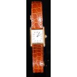 A Cartier ladies 'tank' watch, rectangular silvered dial, Arabic numerals, 'riveted' gold plated