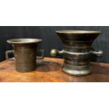 A 17th/18th century bronze mortar, flared rim above a centre girdle and reeded bands, bulbous