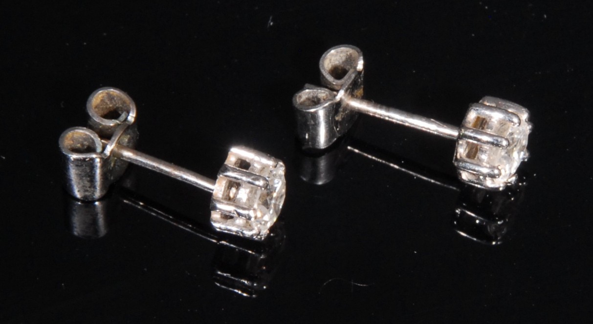A pair of round brilliant cut diamond and 18ct white gold ear studs, ear diamond approximately 0. - Image 2 of 2