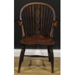 A 19th century ash, beech and elm negative-star-back Windsor elbow chair, hoop back, shaped and