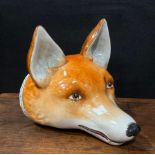 A Samson Hancock stirrup cup as a red foxes mask, naturalistically painted, the collar in gilt