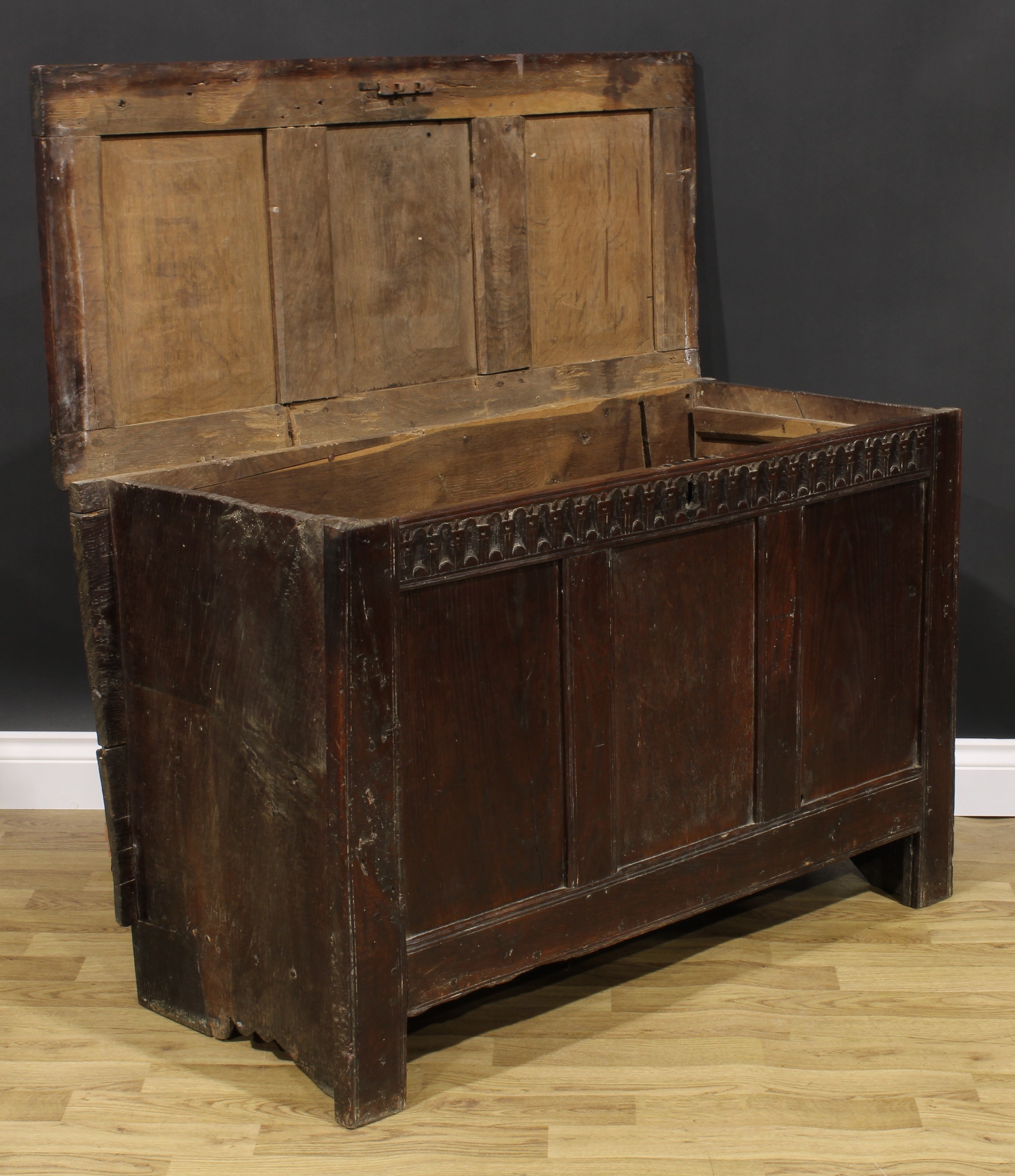 A 17th century oak blanket chest, hinged top, nulled frieze, three panel front, 74cm high, 115cm - Image 3 of 5