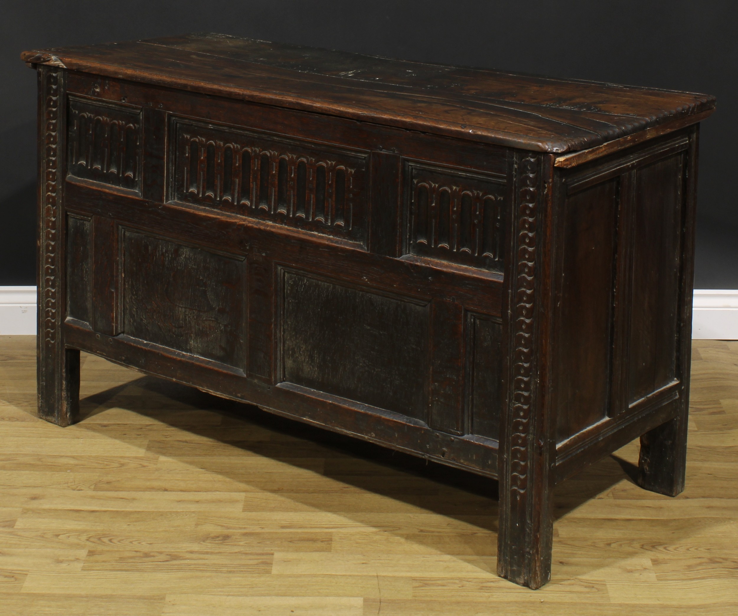A late 17th century oak blanket chest, hinged top above a nulled panel front, the stiles carved with - Image 4 of 5