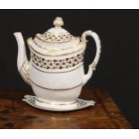 A Flight & Barr Worcester teapot and stand, decorated in brown and gilt with scrolling leaves,