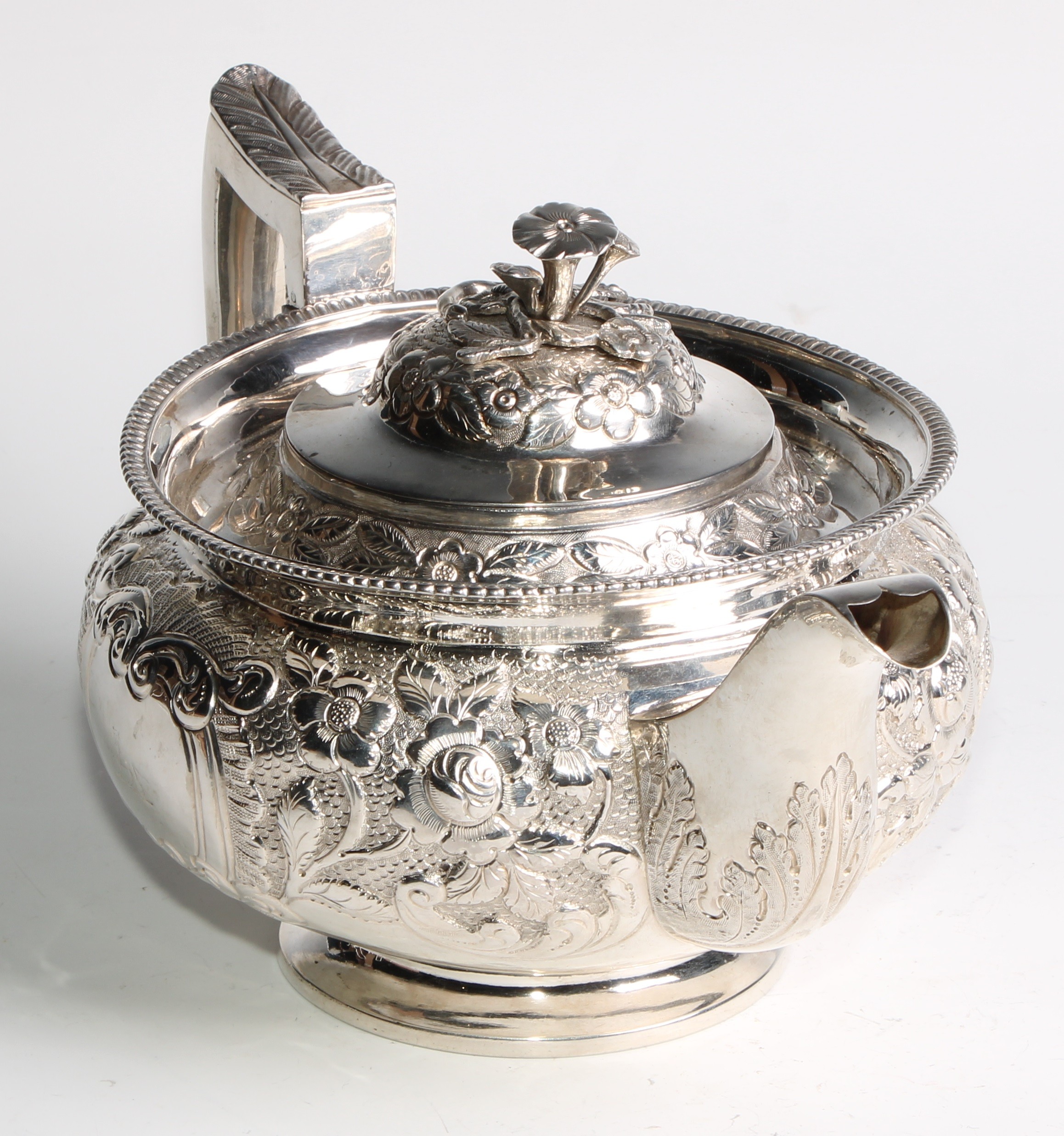 A George III Irish silver teapot, chased with chased with flowers and stiff leaves on a scale - Image 3 of 6