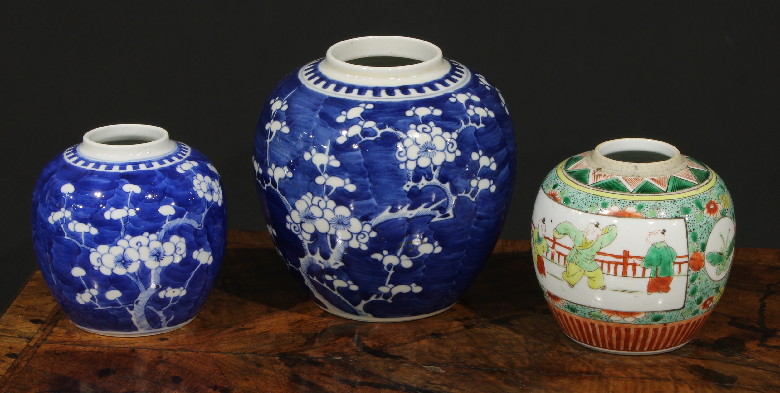A Chinese ovoid ginger jar, painted in tones of underglaze blue with blossoming prunus, 17.5cm high,
