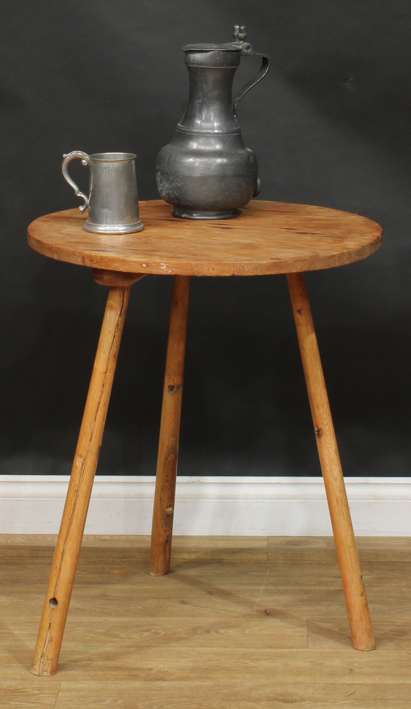 A 19th century pine and ash cricket table, circular top, 73cm high, 61cm diameter