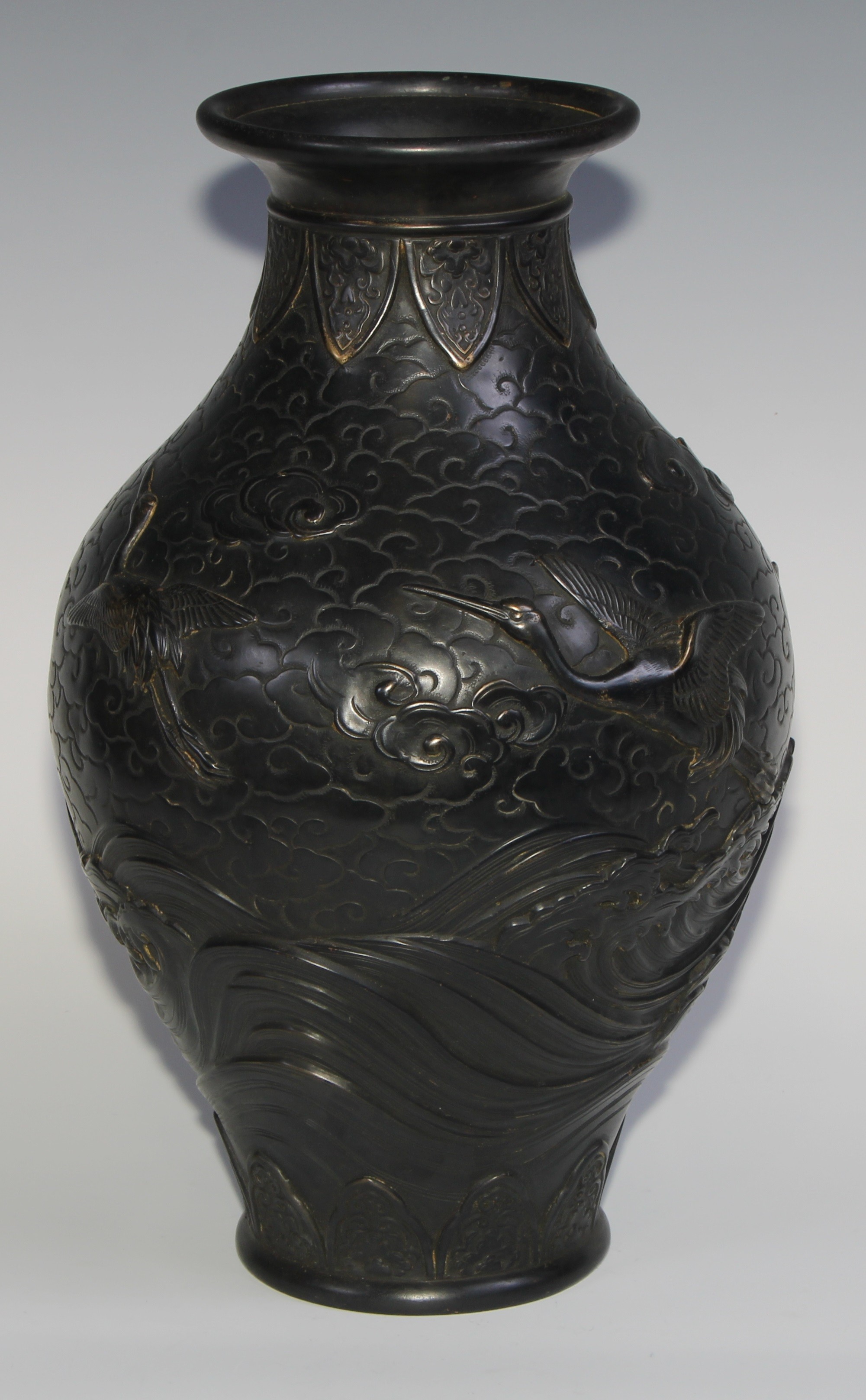 A Japanese dark patinated bronze ovoid vase, cast in relief with cranes taking flight amongst - Image 5 of 7