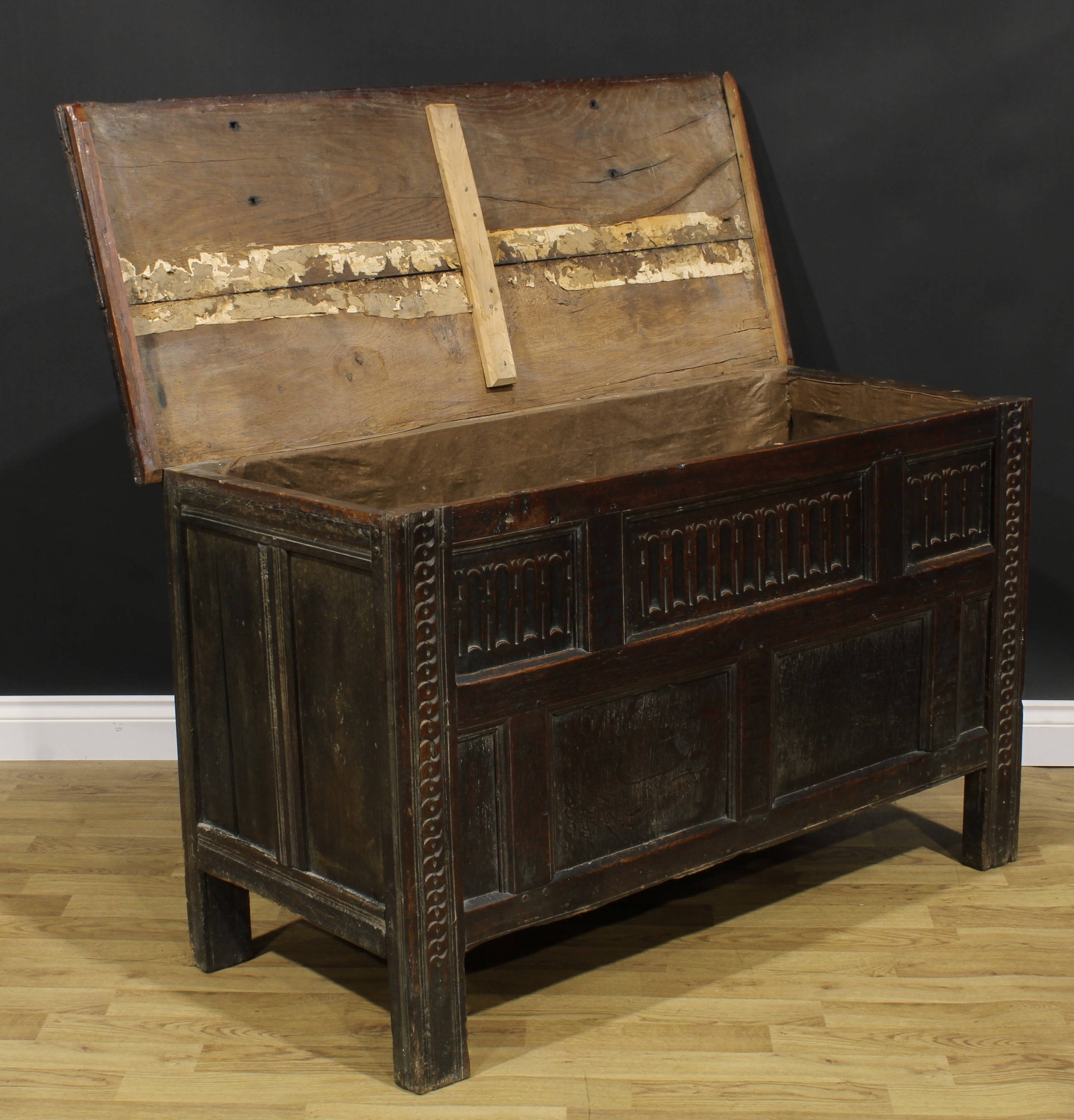 A late 17th century oak blanket chest, hinged top above a nulled panel front, the stiles carved with - Image 3 of 5