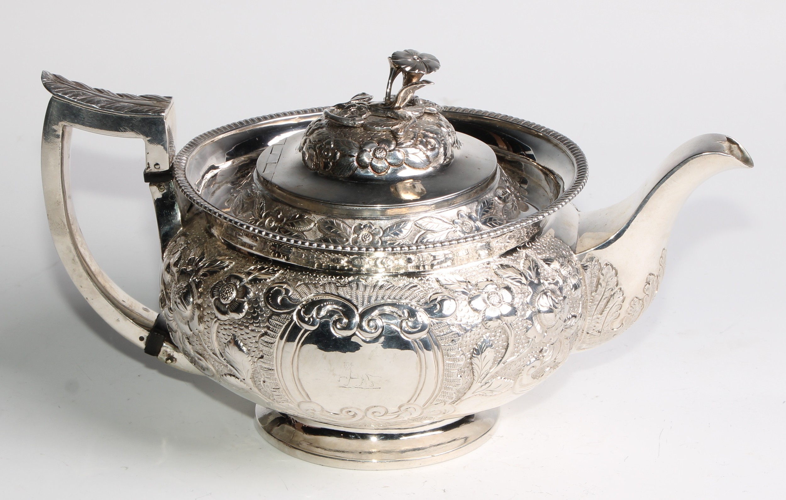 A George III Irish silver teapot, chased with chased with flowers and stiff leaves on a scale - Image 2 of 6