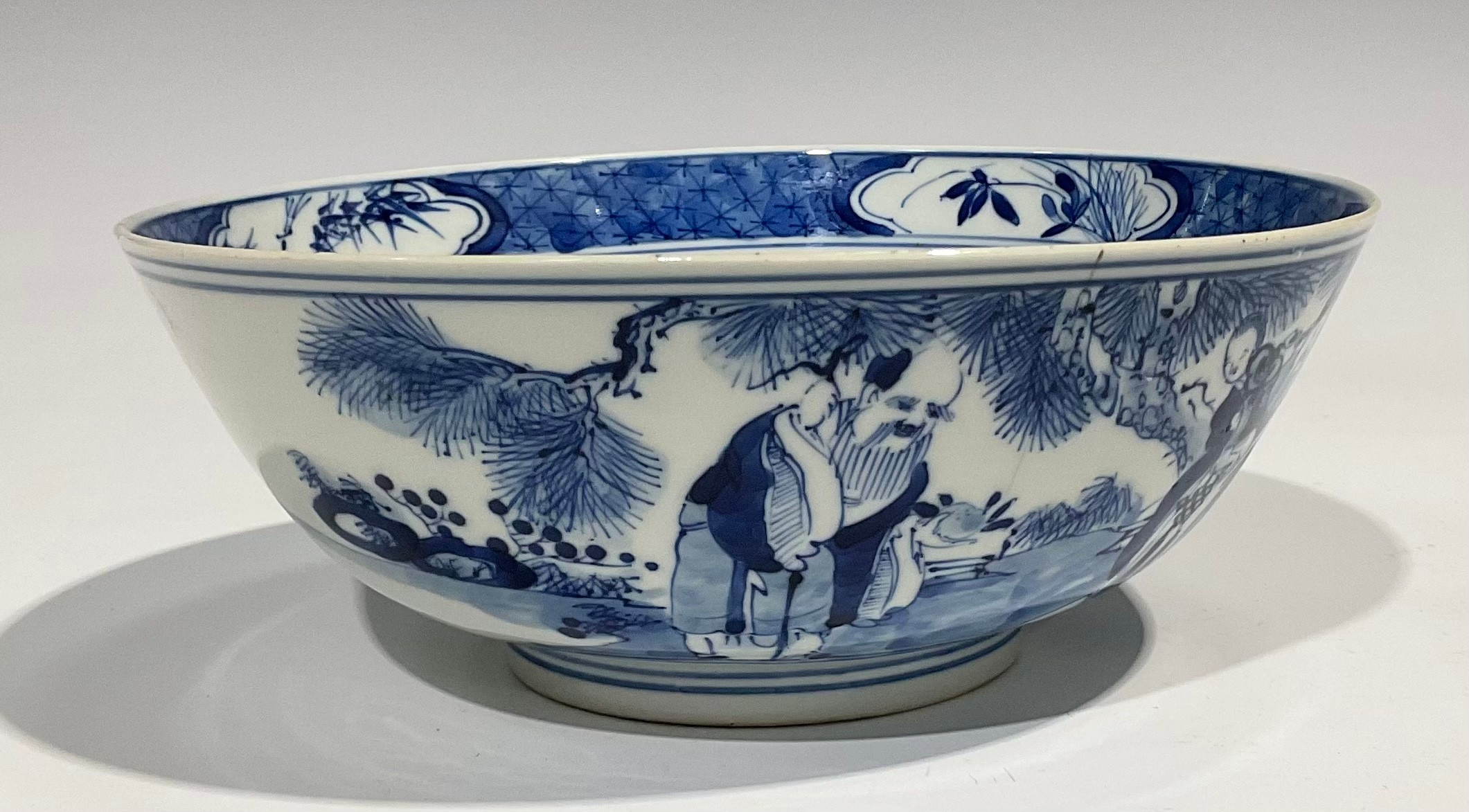 A Chinese circular bowl, playing in tones of underglaze blue with figures in a monumental landscape, - Image 5 of 8