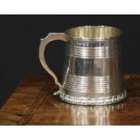 A George IV silver tapered cylindrical child's mug, with two reeded bands above a skirted base
