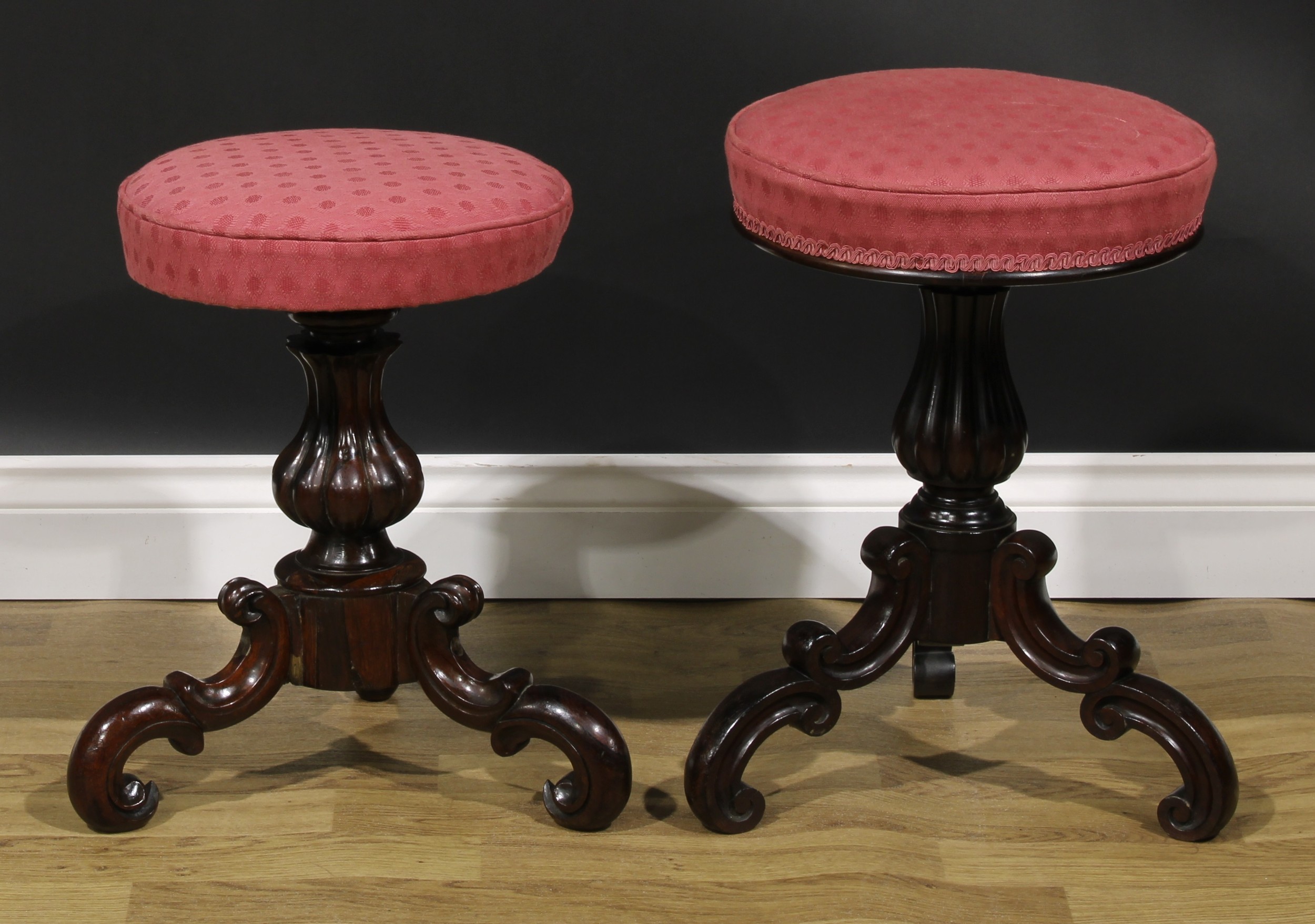 A near pair of Victorian rosewood piano stools, the largest 51cm raising to 74cm high, the seat 35.