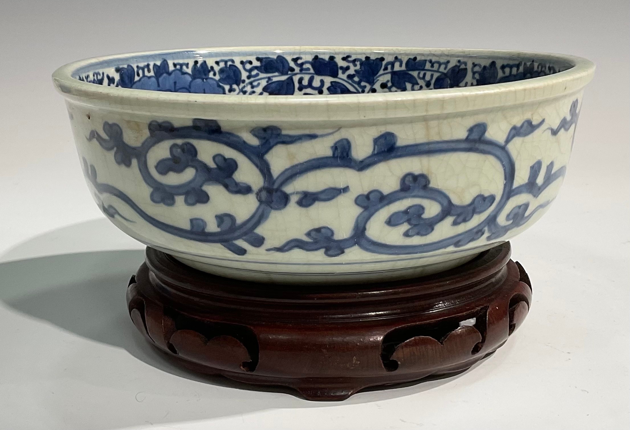 A Chinese circular bowl, painted in tones of underglaze blue with prunus, chrysanthemums and - Image 4 of 5